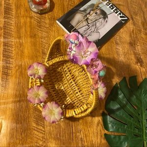 Small light rattan basket with flowers details